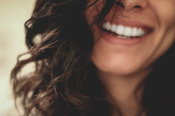Closeup of woman smiling | Health Insurance